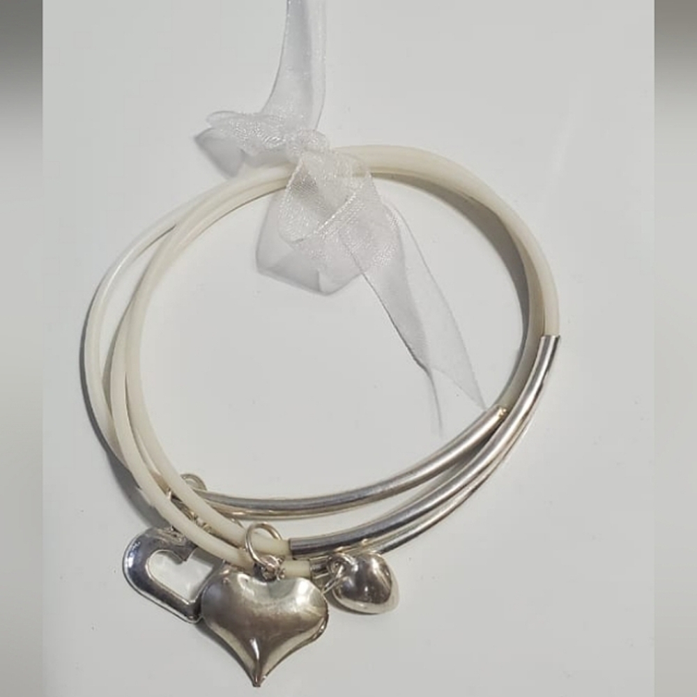 A beautiful Triple silver Bangles With Three Heart Charm. 🌴